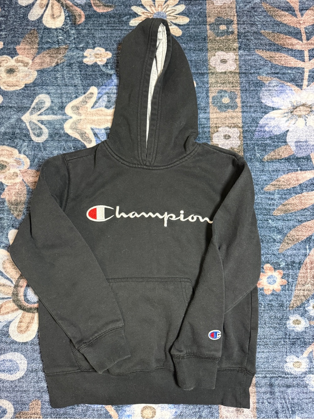 Champion Black Hoodie with Script Logo and Red Accent